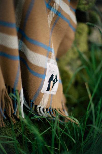 Affric - a checked wool throw in blue, cobalt, cinnamon, beige and brown