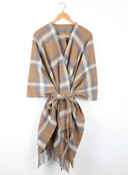 A checked wool cape with a cinnamon ground, highlighted by sky and cobalt blue.