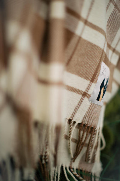 Checked woollen thrown in brown and cream