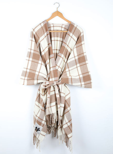 A wool cape with a simple check of natural white and caramel.