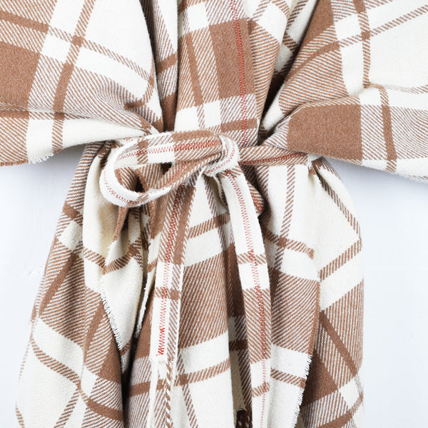 A wool cape with a simple check of natural white and caramel.