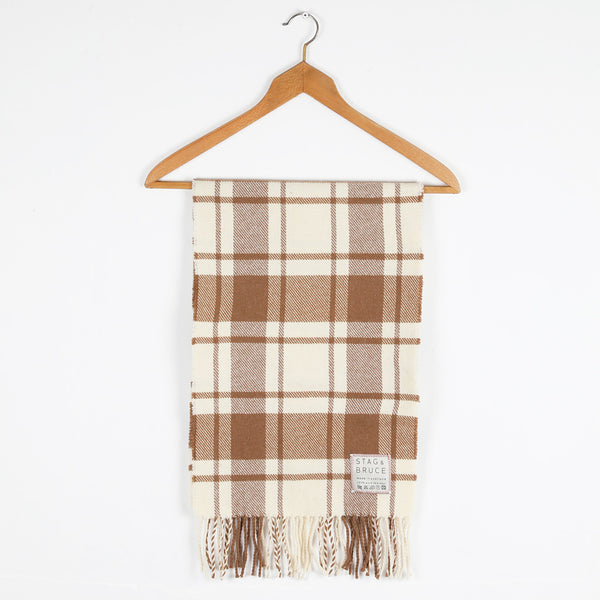 A wool shawl/stole with a simple check of natural white and caramel.